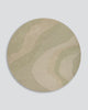Baya Edgewater NZ wool floor rug in Pistachio, round, full view on a plain background, showing the soft wave pattern in sage and cream.
