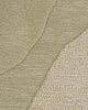 Baya Edgewater NZ wool floor rug in Pistachio, round, close view of the wave pattern showing cut pile beside textured looped pile.