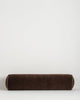 Baya Elliot cotton velvet bolster cushion in Chocolate on a plain background