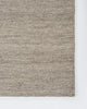 Baya Fairmont NZ Wool Floor Rug in Ash, close view of a folded corner showing the flatweave