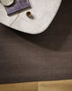 Baya Fairmont NZ Wool Floor Rug in Bracken, overhead view beside a round marble side table with a book