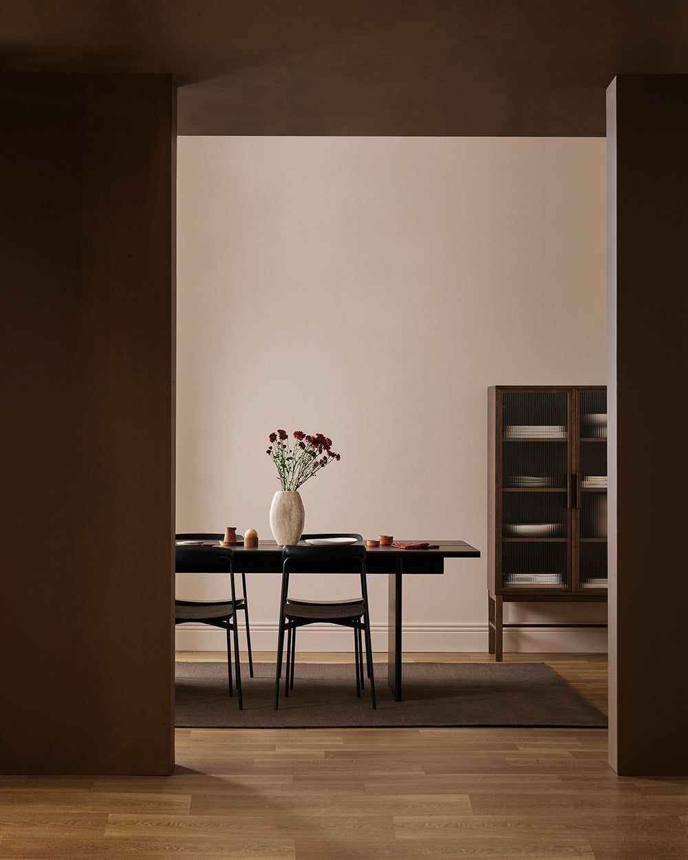 Baya Fairmont NZ Wool Floor Rug in Bracken, alternate wide view of the dining room with a glass-front cabinet