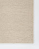 Baya Fairmont NZ Wool Floor Rug in Limestone, close view of a folded corner showing the flatweave
