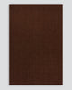 Full-length view of the Baya Linden Floor Rug in Brick, a handwoven flatweave rug in an earthy, faded red-brown wool.
