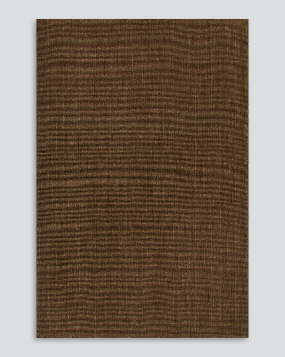 Full-length view of the Baya Linden Floor Rug in Ironbark, a handwoven flatweave rug in an earthy brown wool.