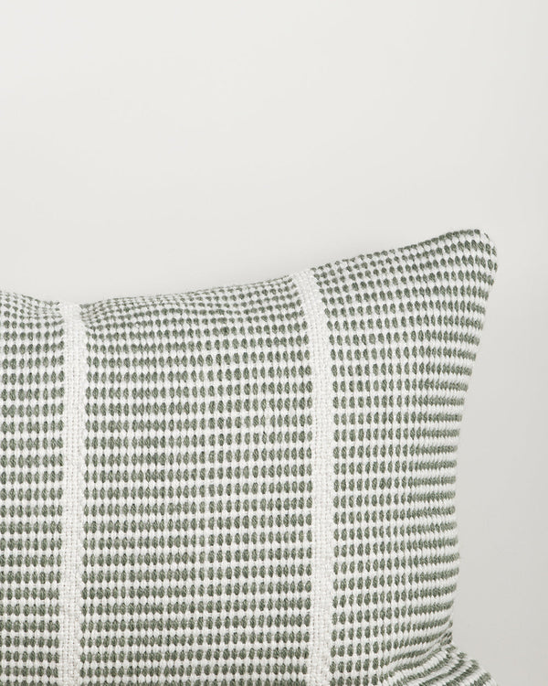 Close-up of the corner and weave texture on the Baya Shore outdoor lumbar cushion in Eucalyptus