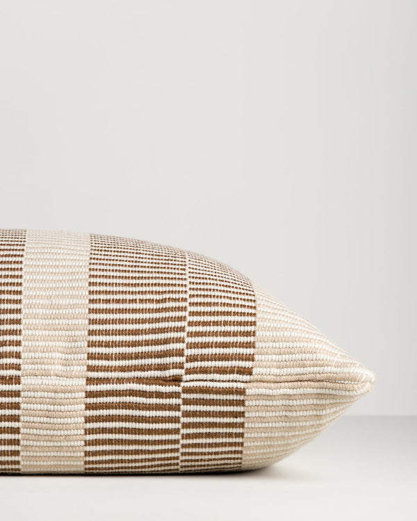 Baya Solar Outdoor Lumbar Cushion in Chocolate, close view of the end gusset and stripe weave.