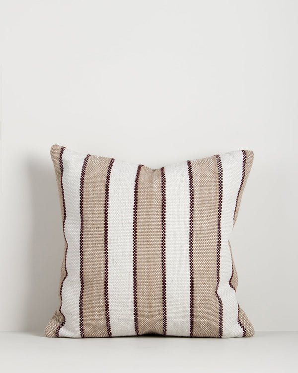 Baya Tidal Outdoor Cushion in Terracotta on a plain background, showing the camel stripe and deep red pinstripe weave.