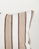 Baya Tidal Outdoor Cushion in Terracotta, close view of the woven texture in camel, ecru and deep red tones.