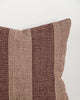Close-up of the Baya Tide Outdoor Cushion in Claret, showing the woven linework stripe and piped edge.