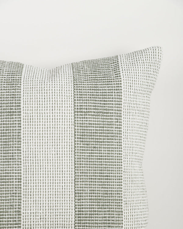 Close-up of the Baya Tide Outdoor Cushion in Eucalyptus, showing the woven linework stripe and piped edge.