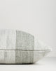 Side view of the Baya Tide Outdoor Cushion in Eucalyptus, showing the handwoven stripe wrapping the cushion edge.