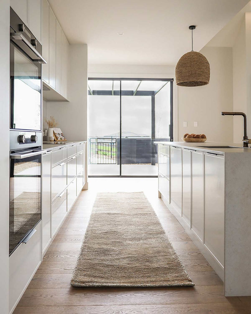 Anchorage floor runner in Sand Dune by Baya NZ situated in a modern kitchen.