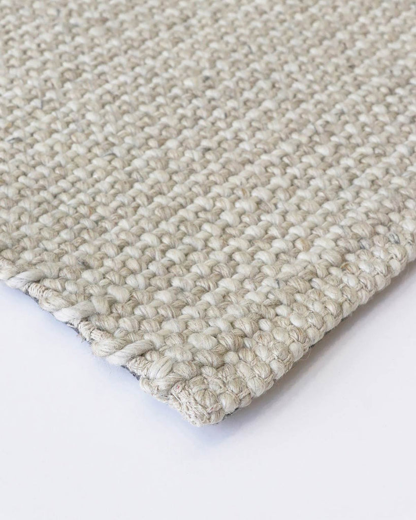 A close up corner view of the Kansas rug by Baya NZ in the shade Oatmeal/Natural