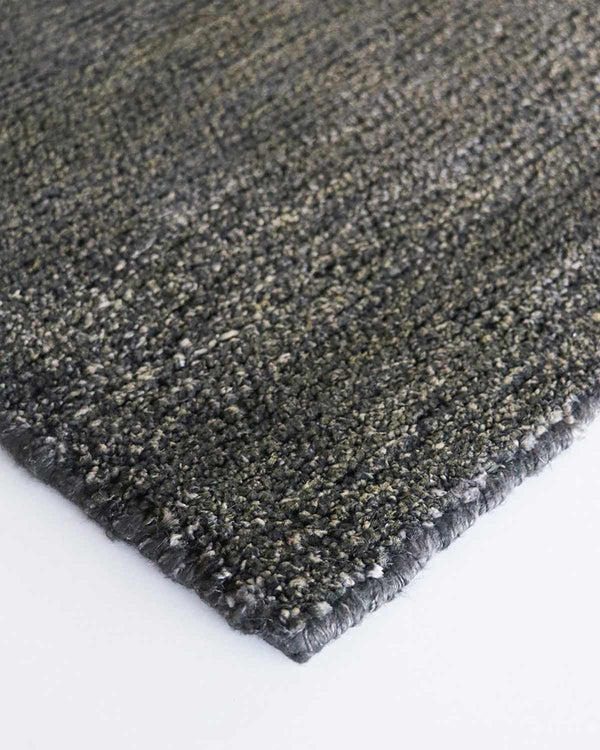 Close up view of corner of Baya NZ Anchorage floor runner in Gravel, showing the texture of the jute/wool blend. 