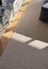 By Carmont Bisque floor rug in Cameo styled in an indoor living space