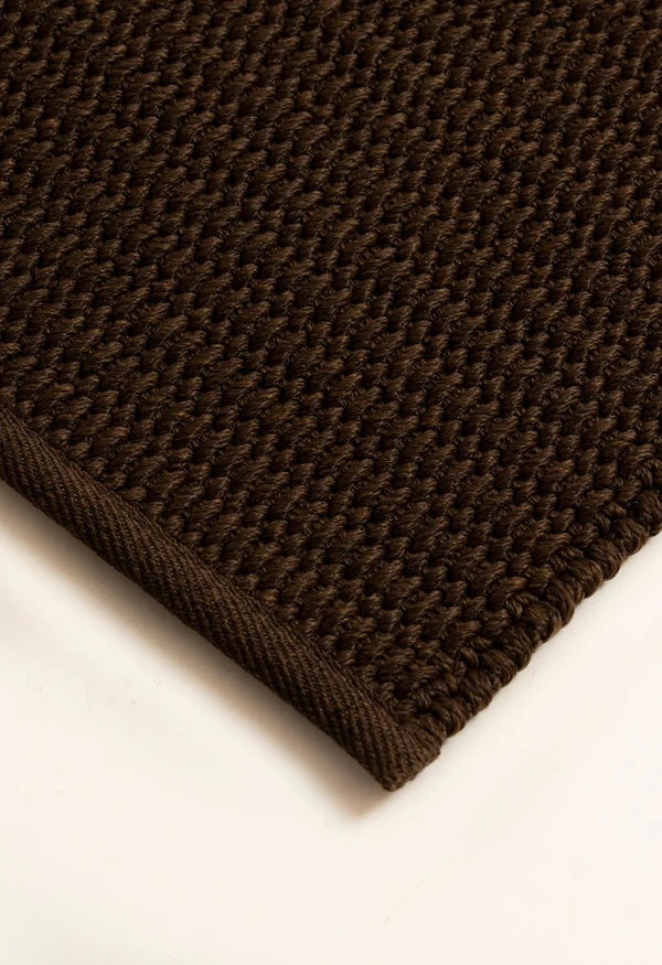 Detail shot of the By Carmont Bisque floor rug's weave in Coffee
