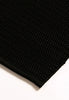 By Carmont Bisque floor rug in Sable, close-up of the textured weave and bound edge