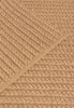 By Carmont Aman floor rug in Natural, corner fold detail showing the braided edge binding