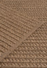By Carmont Aman Floor Rug in Topaz, close-up of the weave with the binding edge across the diagonal
