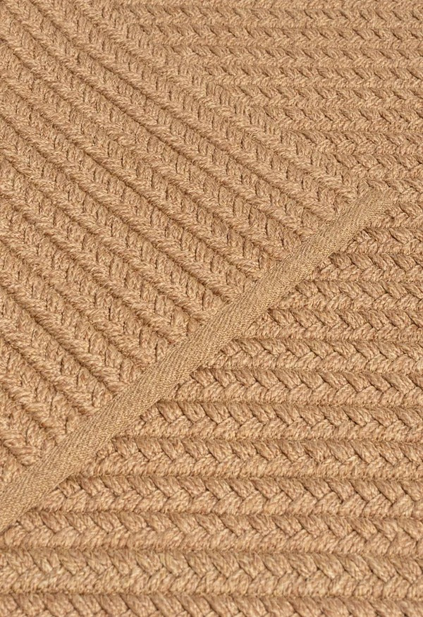 By Carmont Aman Runner in Natural, close-up of the hand-plaited weave with the binding edge across the diagonal