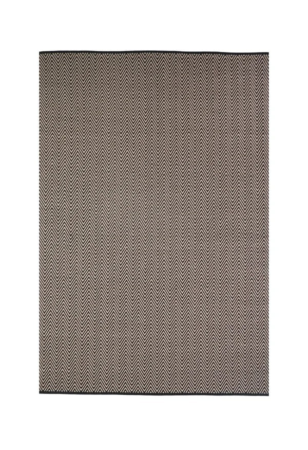 By Carmont Bhumi Floor Rug in Seraphic, full flat lay showing the black and natural chevron pattern