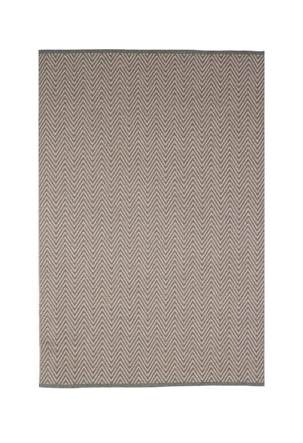 By Carmont Bhumi Floor Rug in Umber, full flat lay showing the charcoal and natural chevron pattern