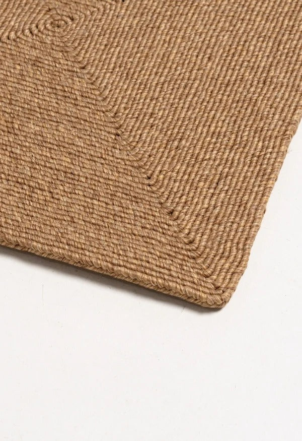 By Carmont Capella floor rug in Natural, close view of the corner and border detail