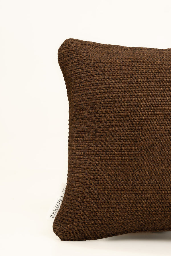 By Carmont Huxley cushion cover in Coffee, corner close-up showing the woven texture and brand label