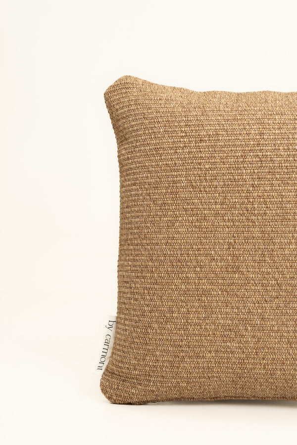 By Carmont Huxley cushion cover in Natural, corner close-up showing the woven texture and brand label