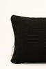 By Carmont Huxley cushion cover in Sable, corner close-up showing the woven texture and brand label