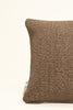 By Carmont Huxley cushion cover in Topaz, corner close-up showing the woven texture and brand label