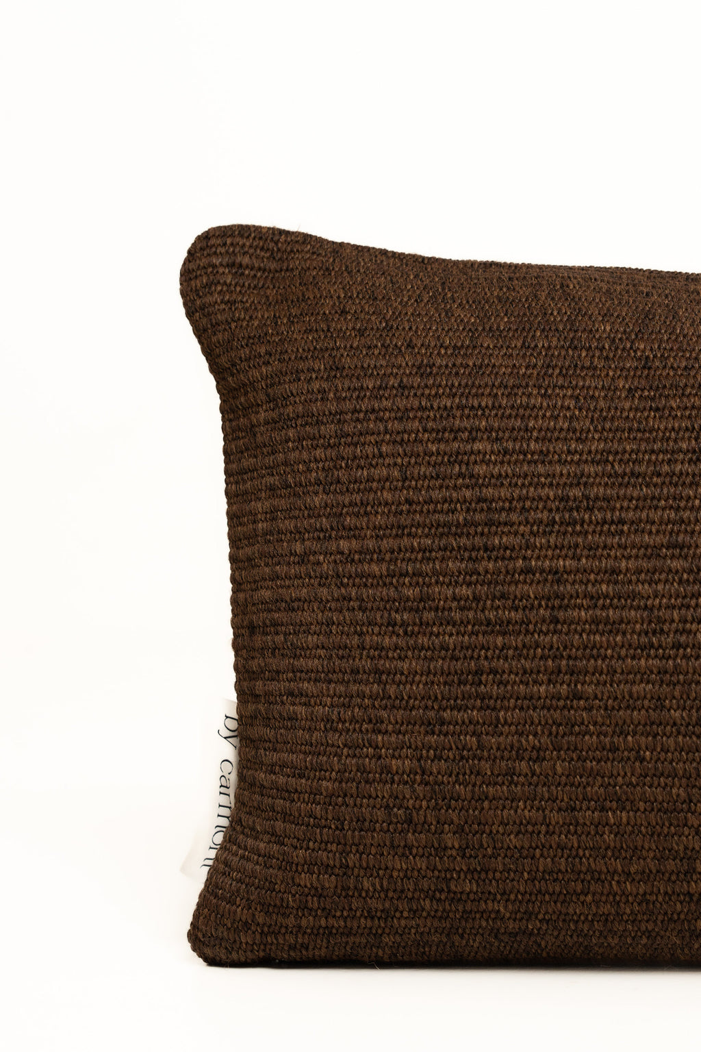By Carmont Leroy cushion cover in Coffee, corner close-up showing the woven texture and brand label