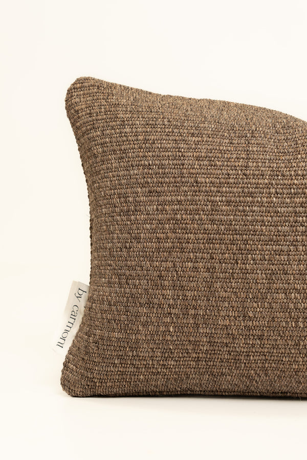 By Carmont Leroy cushion cover in Natural, corner close-up showing the woven texture and brand label