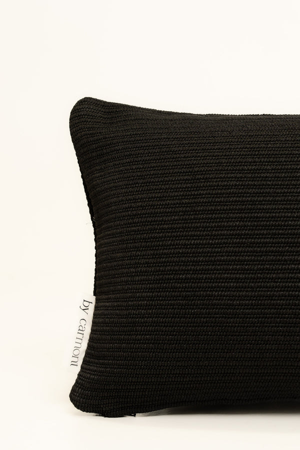 By Carmont Leroy cushion cover in Sable, corner close-up showing the woven texture and brand label