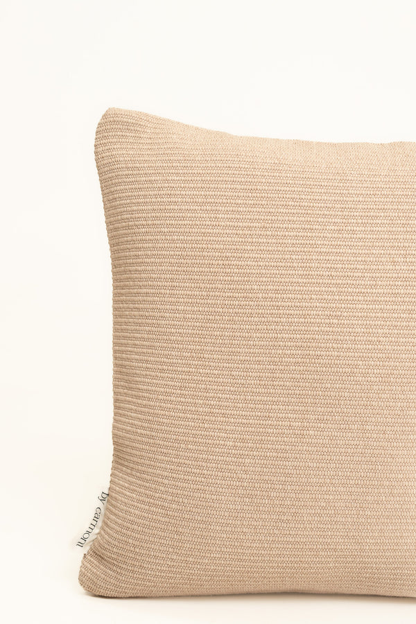 By Carmont Wren cushion cover in Cameo, corner close-up showing the woven texture and brand label