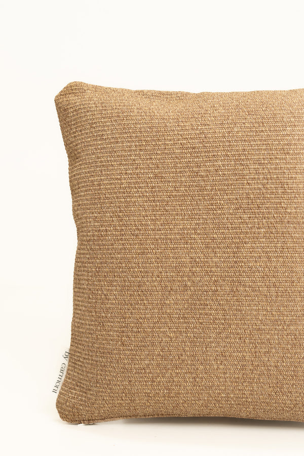 By Carmont Wren cushion cover in Natural, corner close-up showing the woven texture and brand label