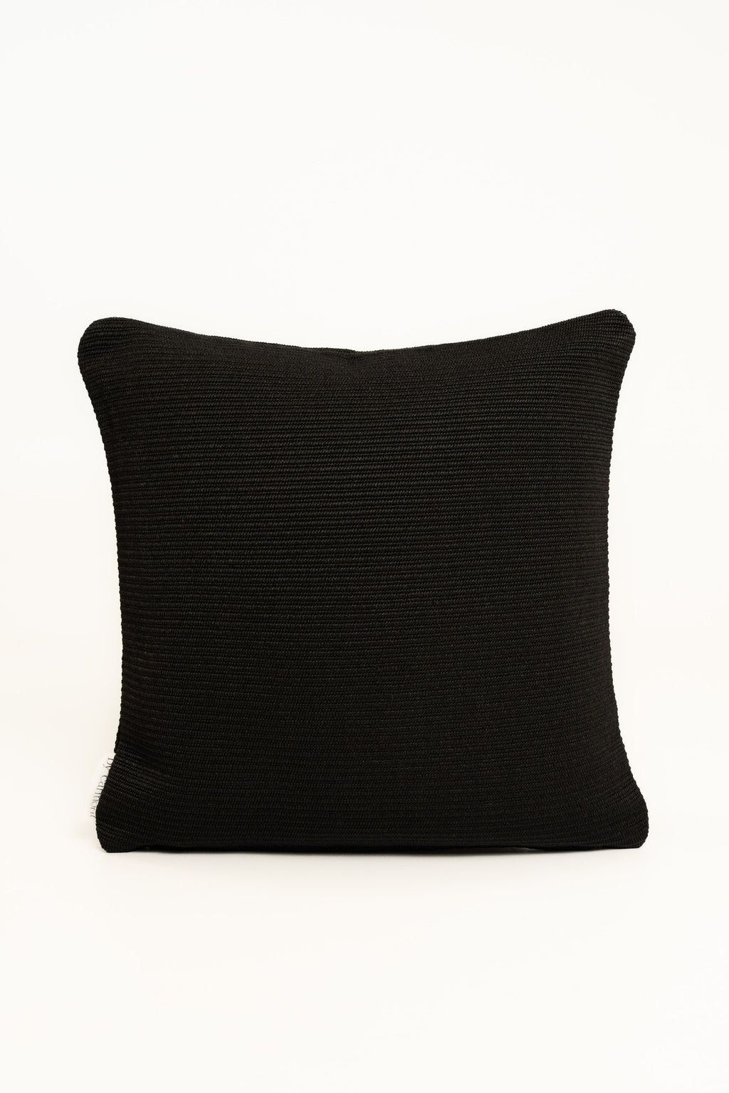 By Carmont Wren cushion cover in Sable, plumped front view on a white background