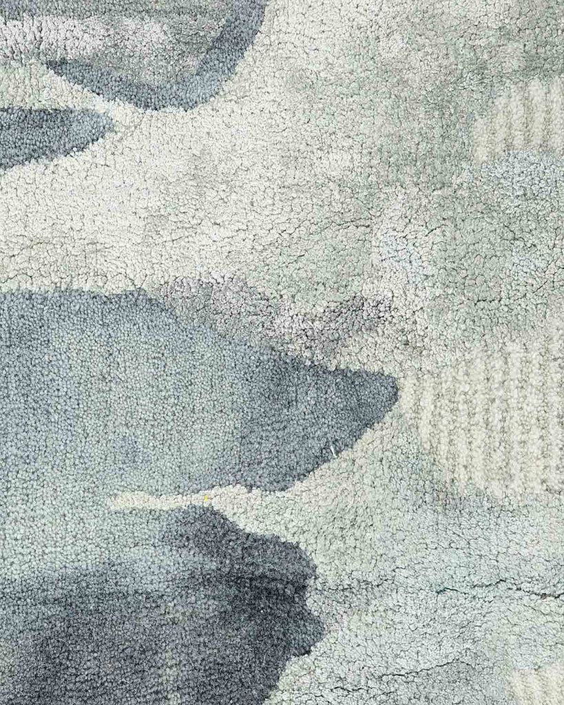 Close up of Baya NZ cool blue and grey tufted rug. 