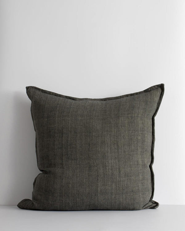 A square cushion in handwoven linen in an on trend deep green shade. 