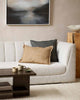 A stylish living room with two cushions by Baya on the cream couch