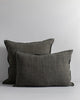 A pair of matching cushions, one lumbar and one square, both in a deep on-trend green-grey colour. 