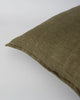 Close up of the Baya linen cushion, with flange edge detail, in colour military green