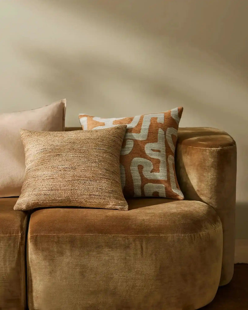 Designer cushions in warm brown tones, by Weave Home nz