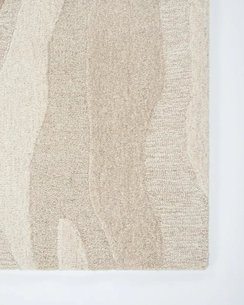 Corner of the Baya 'Shoreline' wool rug showing textural cut and loop pile design