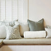 Eadie Lifestyle Drift cushion in White/Pistachio styled on a window seat with linen cushions in soft green tones