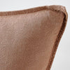 Close view of the flange edge and corner on the Luca cushion in Clay.