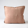 Eadie Lifestyle Luca linen cushion in Clay, square, on a plain background.