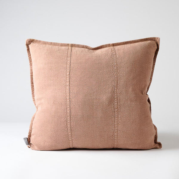 Eadie Lifestyle Luca linen cushion in Clay, square, on a plain background.