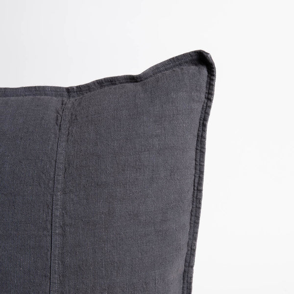 Close view of the Eadie Lifestyle Luca linen cushion in Midnight at the corner and edge.